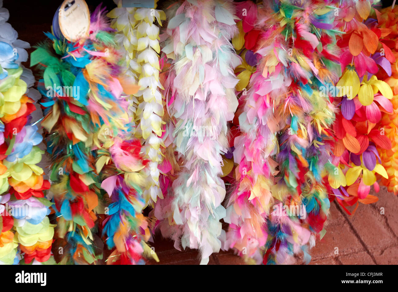 A rack of feather boas on a stall for sale Stock Photo