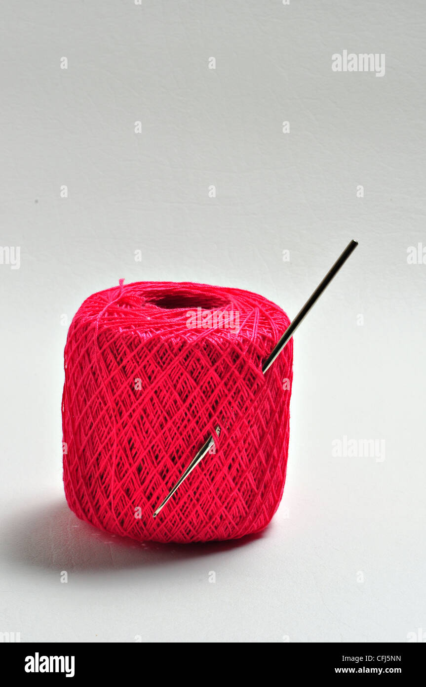 A crochet needle is struck in a ball of crochet thread Stock Photo Alamy
