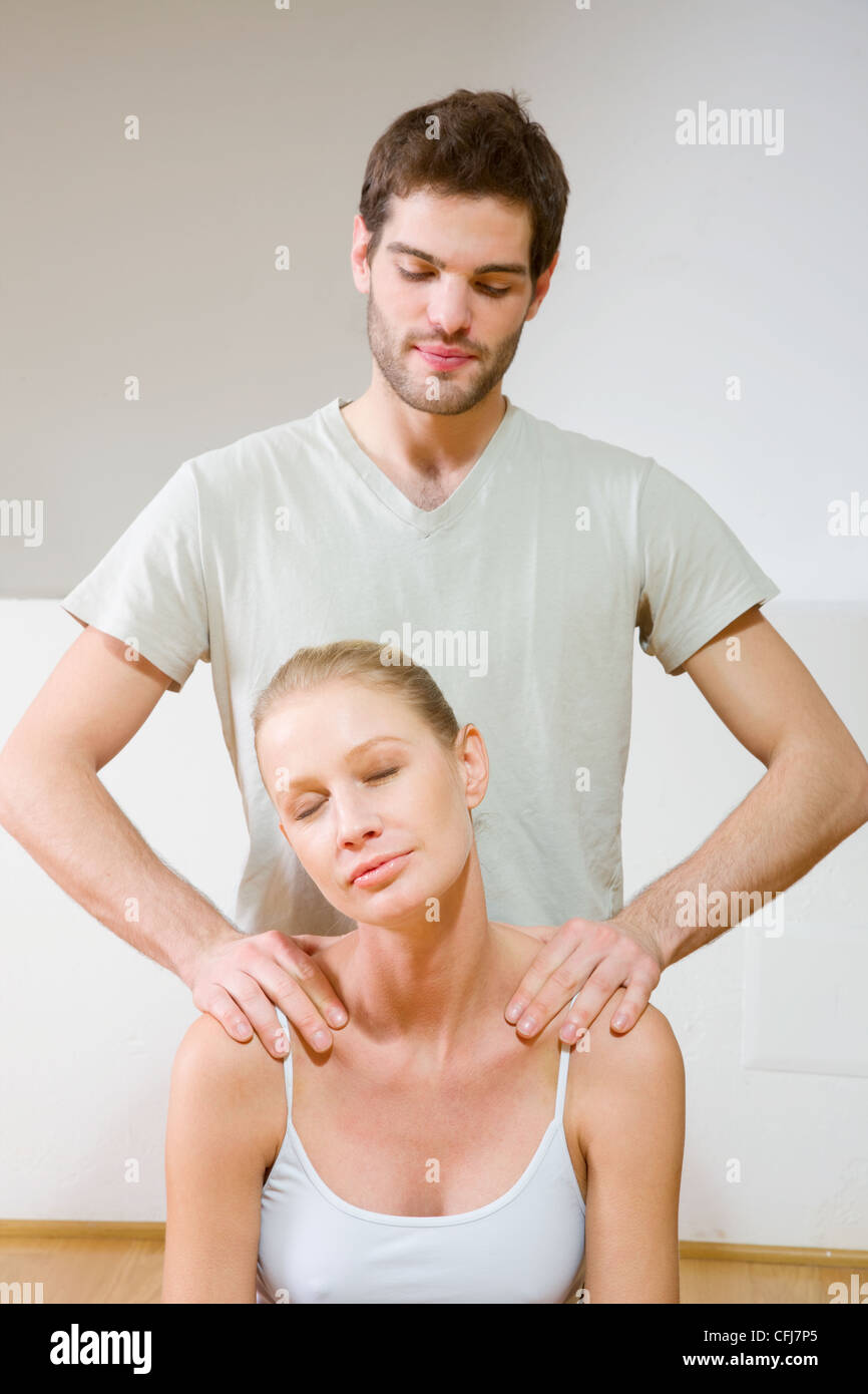 man massaging woman's shoulders Stock Photo Alamy