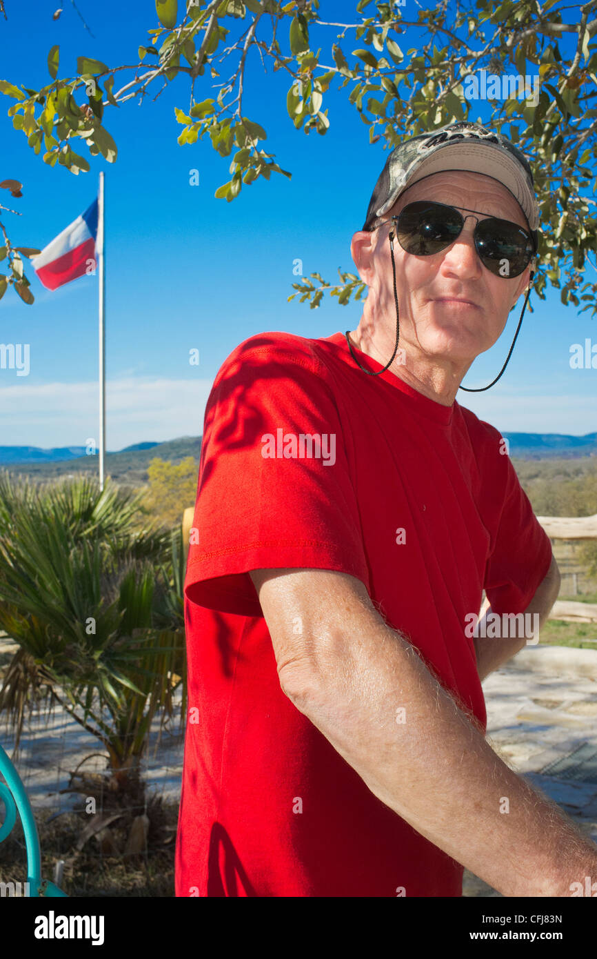 American senior man with Texas flag in background Stock Photo