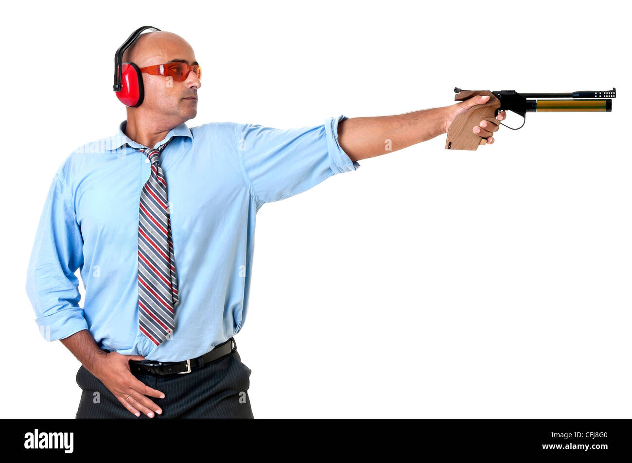 Businessman with compressed air gun shooting at a target Stock Photo