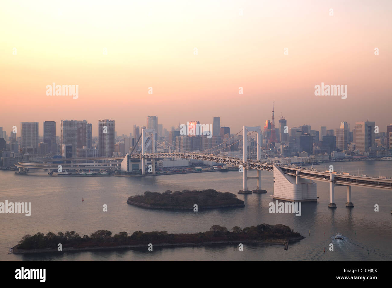 View of Tokyo downtown at night with Rainbow Bridge Stock Photo