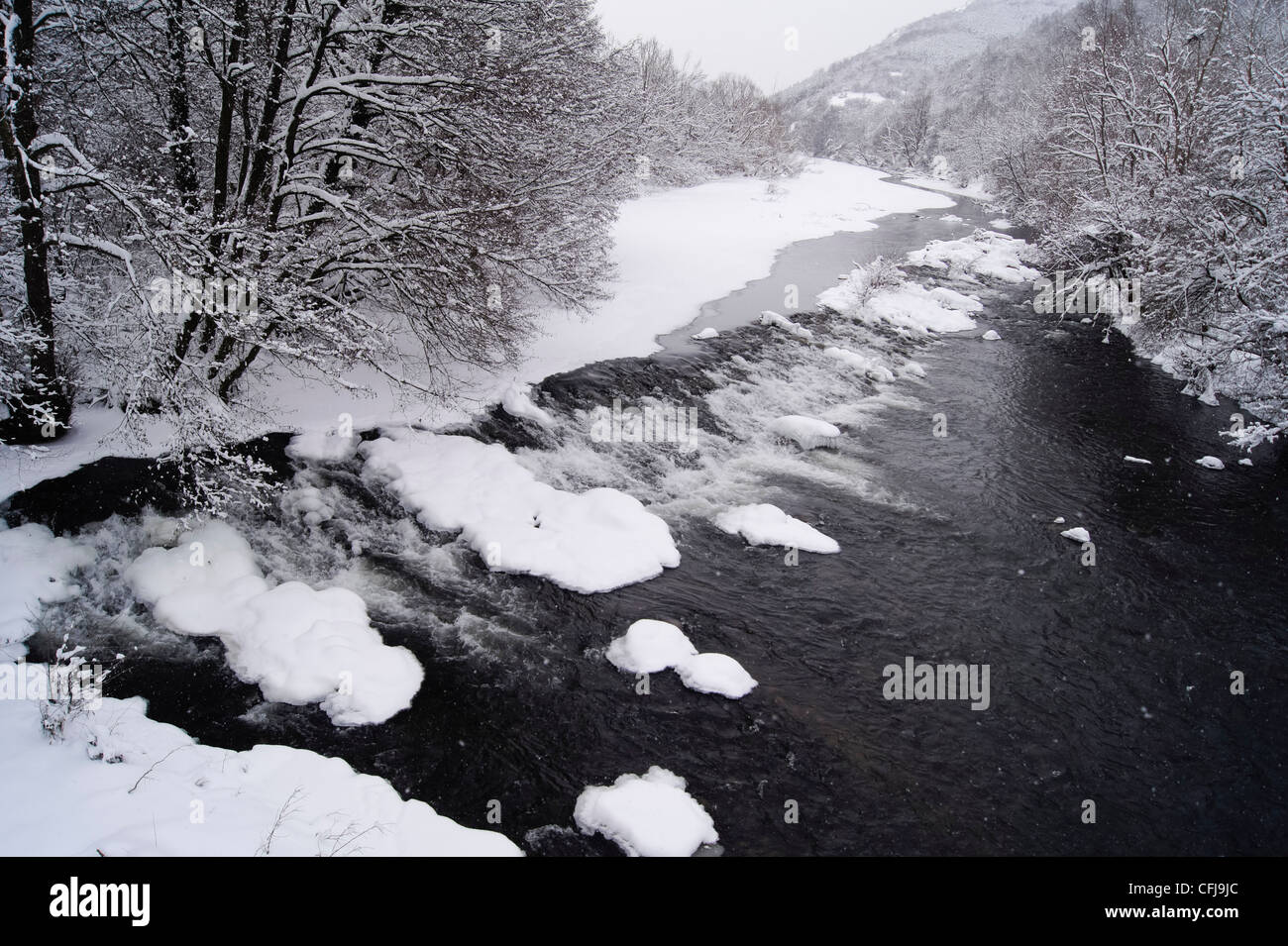 Frozen river covered snow in hi-res stock photography and images - Alamy