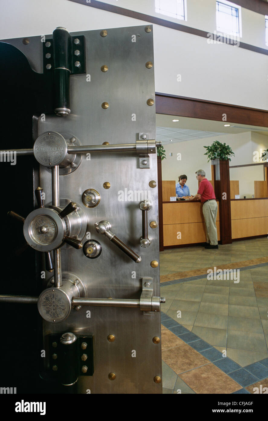 Bank vault door in teller lobby Stock Photo