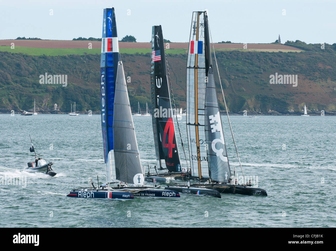 America's Cup World Series racing catamarans during close racing in Plymouth Sound, UK Stock Photo
