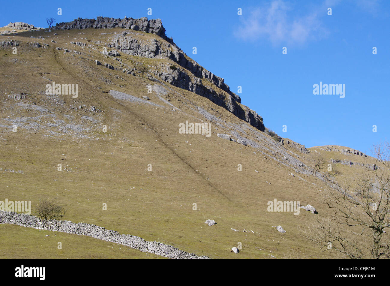 rugged hillside on a beautiful February day in Malham Stock Photo