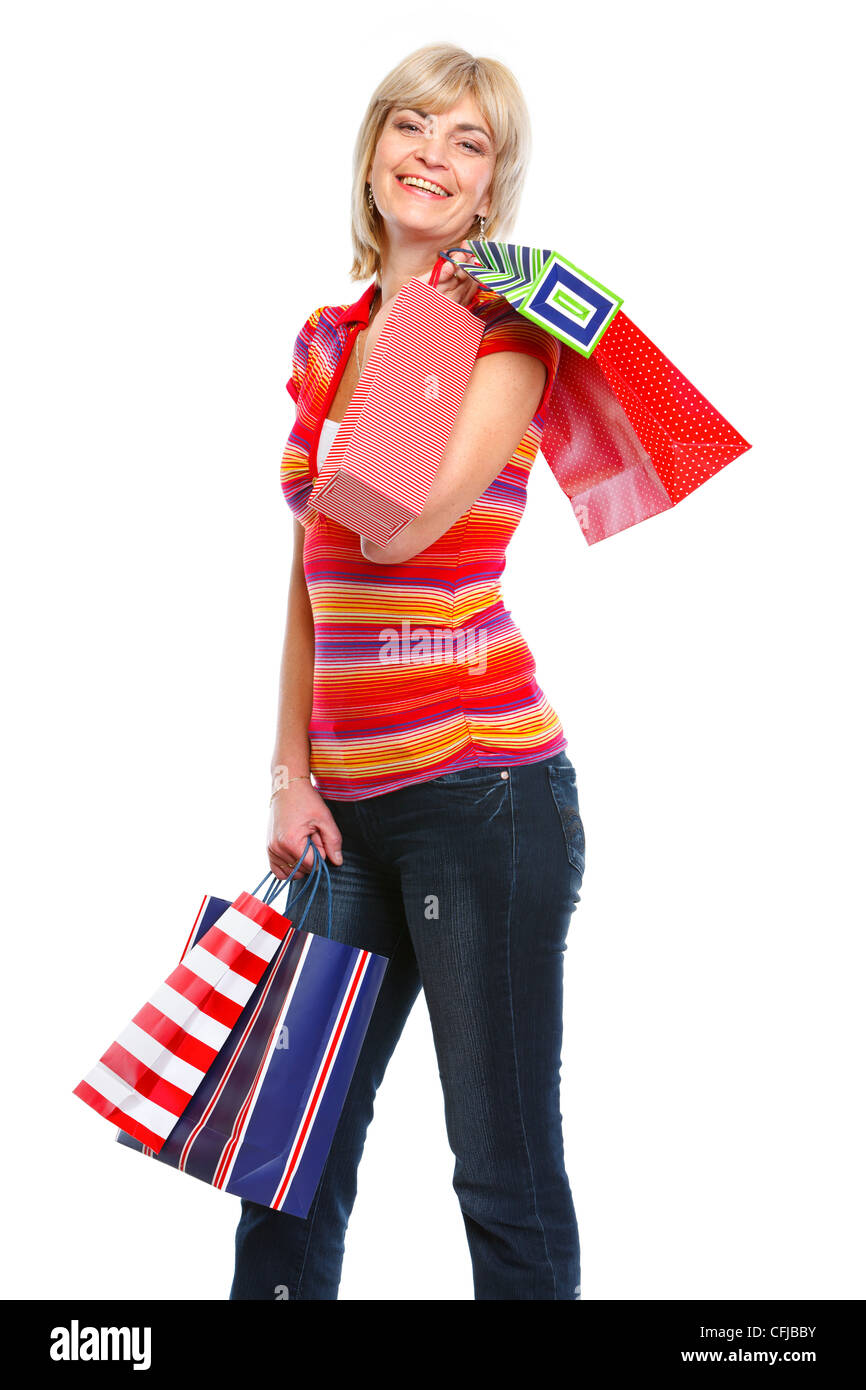 Smiling elderly woman with shopping bags Stock Photo