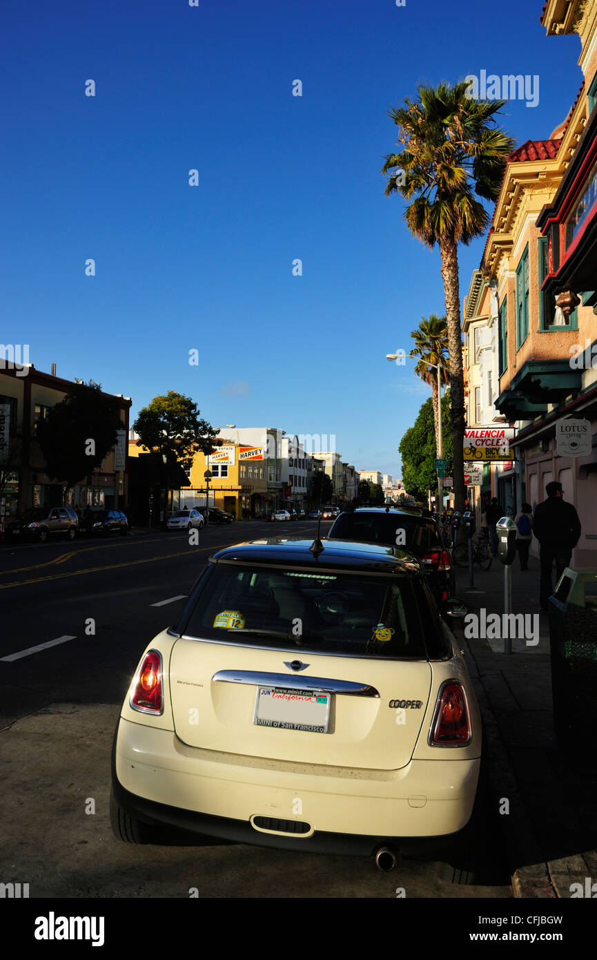 A Mini Cooper parked on Valencia Street in the Mission District, San Francisco CA Stock Photo