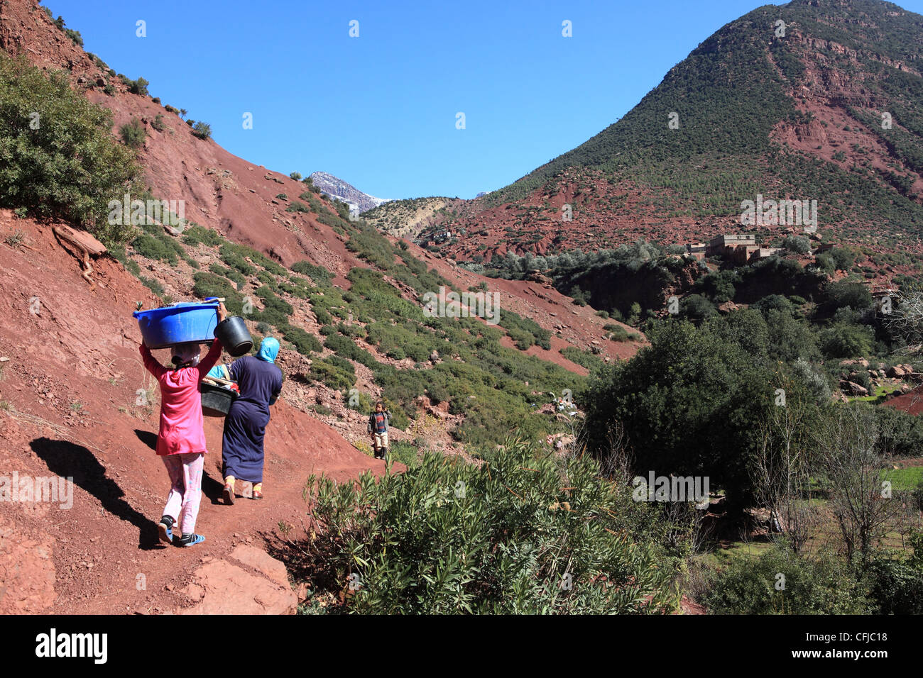 Locals working in the Vallee d'ourika in the Atlas mountains in Morocco Stock Photo