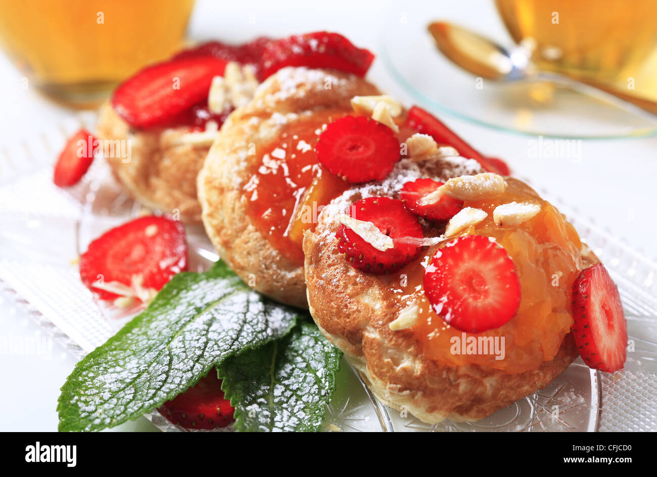Griddle cakes topped with jam Stock Photo Alamy