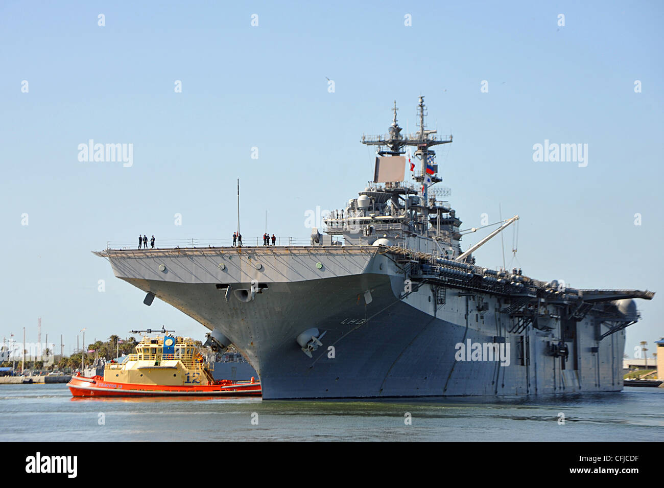 The amphibious assault ship USS Wasp (LHD 1) pulls into Naval Station Mayport for a port visit. Wasp left her homeport of Norfolk to conduct routine operations in the waters of the Southern Caribbean and use the degaussing range in Mayport, Fla. Stock Photo