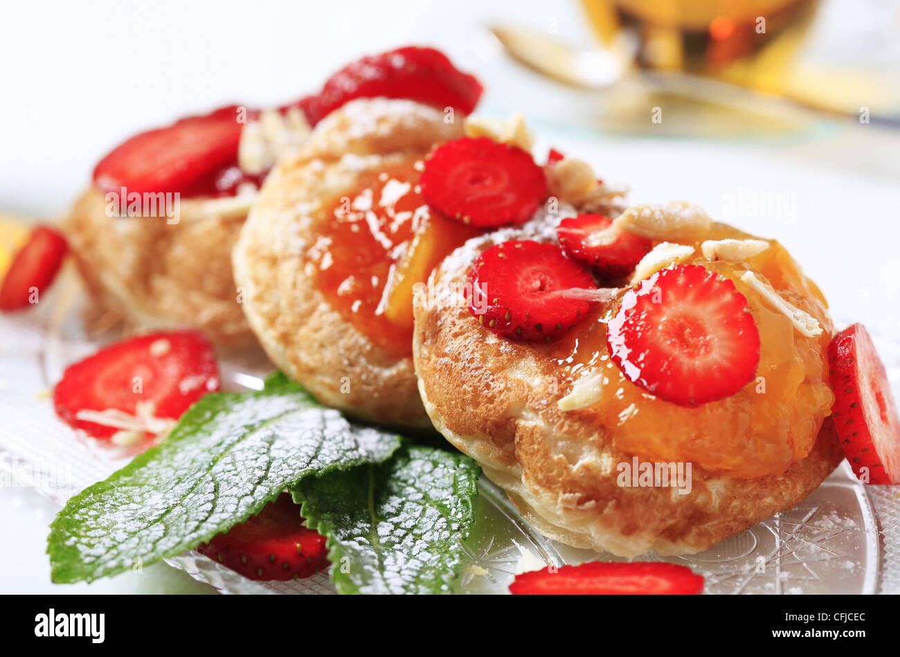 Griddle cakes topped with jam Stock Photo Alamy