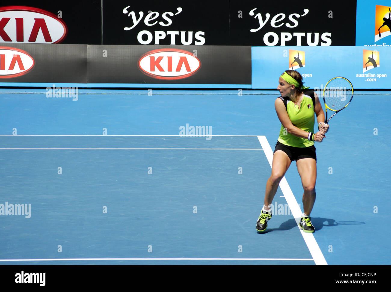 MELBOURNE, AUSTRALIA - JANUARY 21, 2012: WTA tennis player Svetlana Kuznetsova waits to hit a backhand to Sabine LIsicki. Stock Photo
