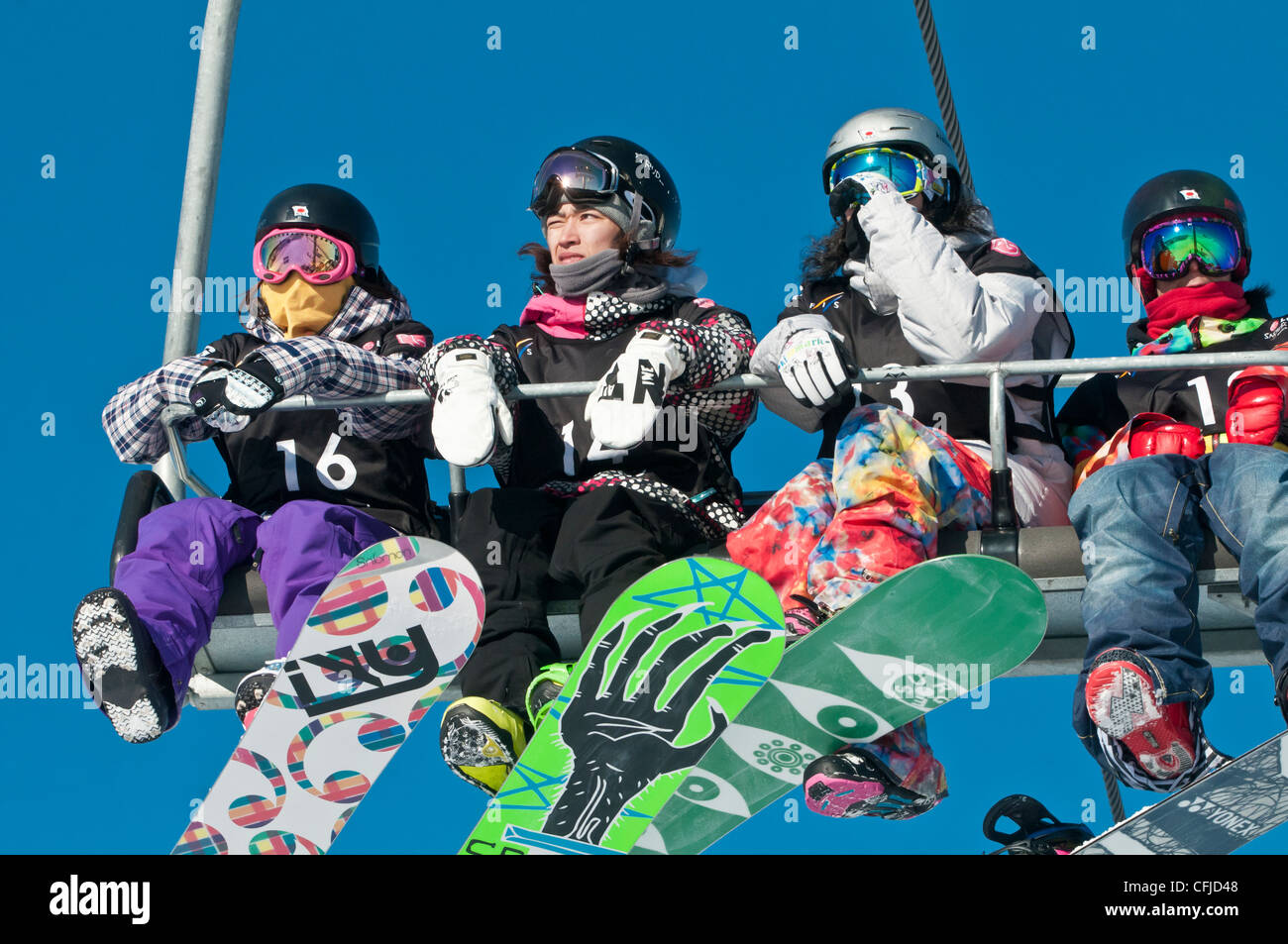 Asian snowboarders on a ski lift, Canada Olympic Park, COP, Calgary,  Alberta, Canada Stock Photo - Alamy