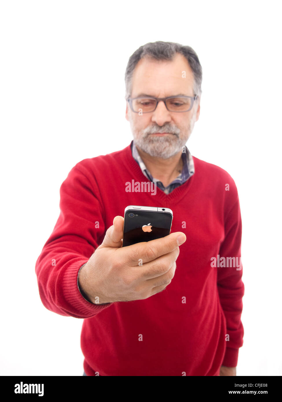Middle-aged man holding iPhone isolated on white background Stock Photo