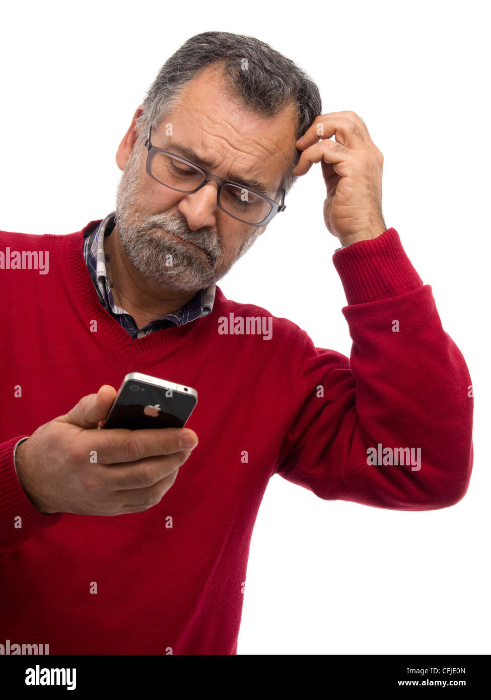 Confused mature man using iPhone Stock Photo