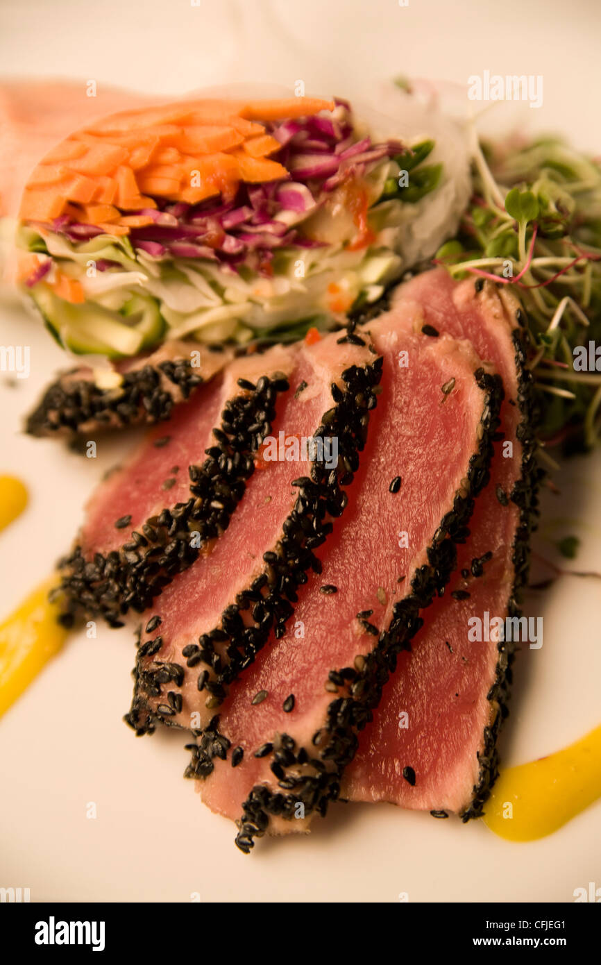 Seared ahi tuna encrusted with toasted sesame seeds Stock Photo Alamy