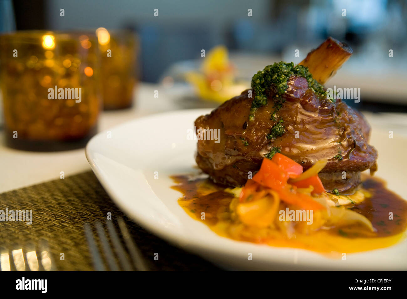 Roast bonein pork loin with vegetable ragout Stock Photo Alamy