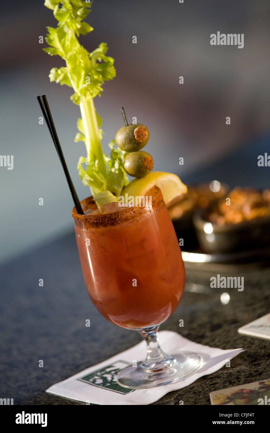 Classic Bloody Mary garnished with celery stick and stuffed olives Stock Photo