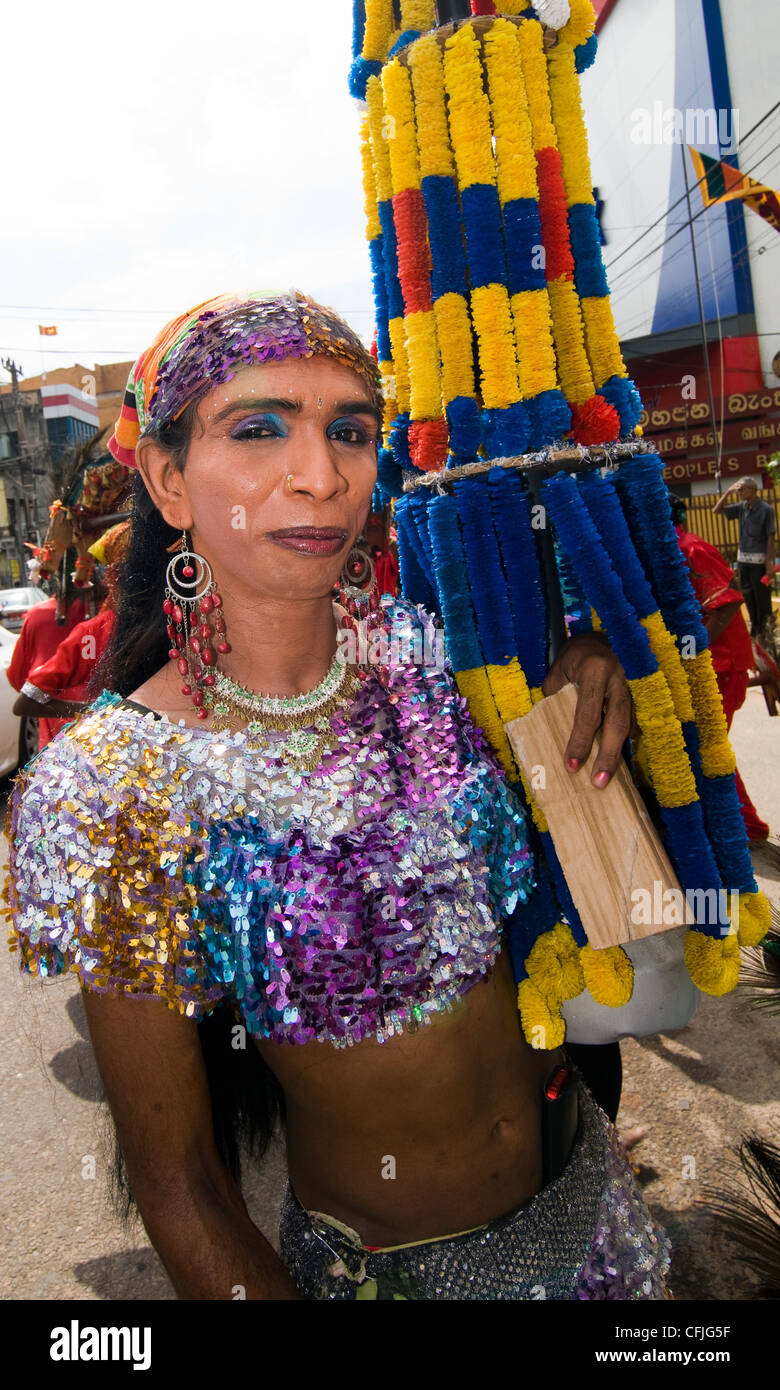 A colorful festival in Sri lanka. men dressed in drag dance to the beat of the drums. Photo taken during Thaipussam festival. Stock Photo