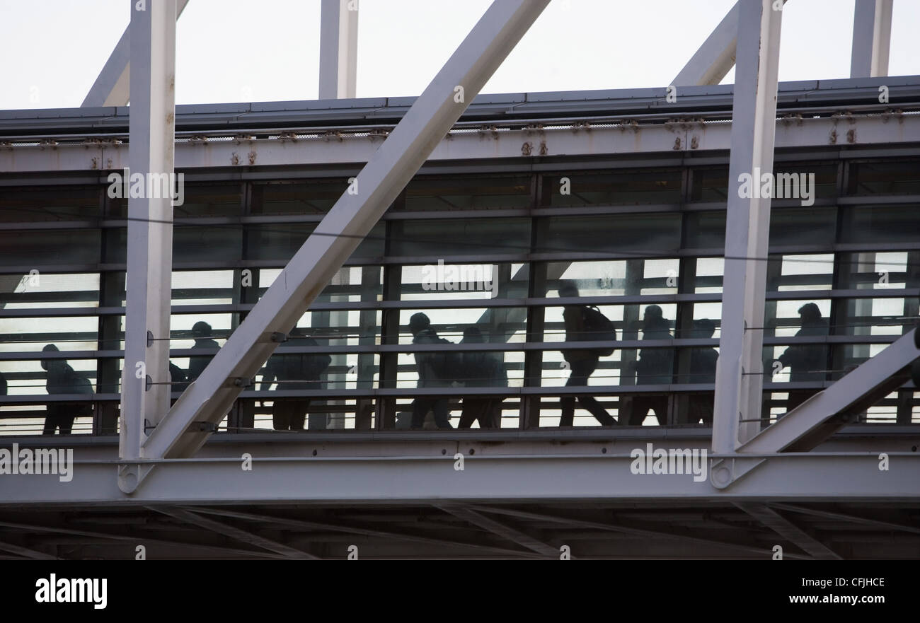 People on an elevated walkway Stock Photo
