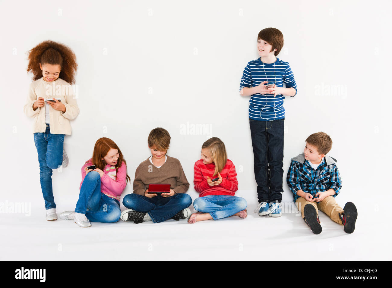 Children using different gadgets Stock Photo Alamy