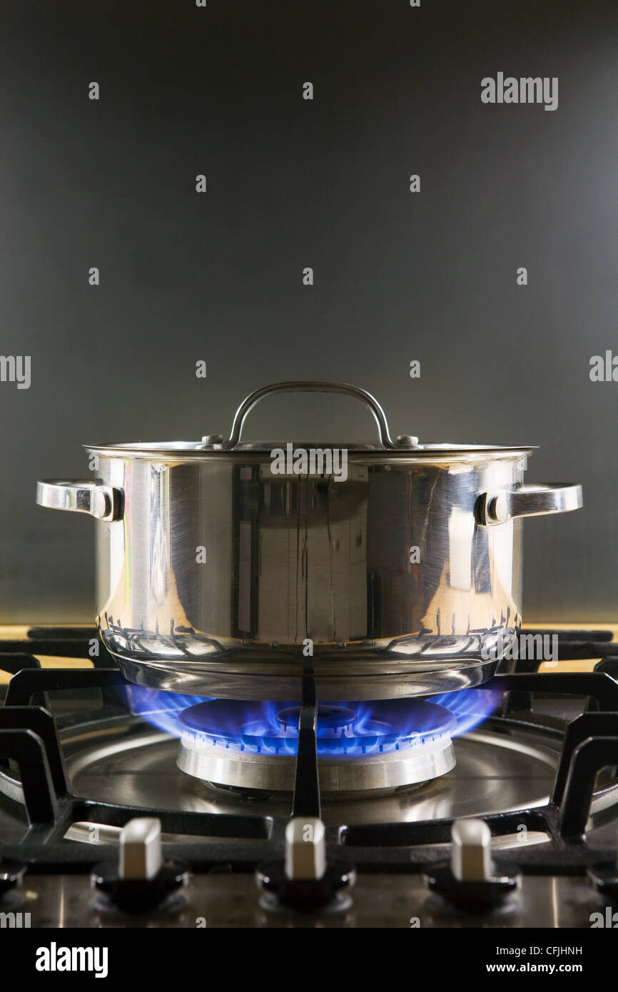 Pan on a gas hob Stock Photo Alamy