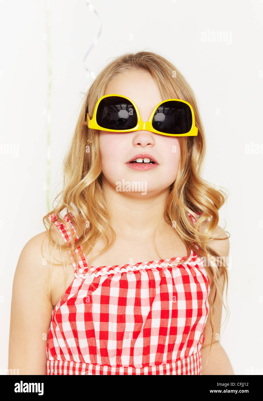 Girl with sunglasses on upside down Stock Photo