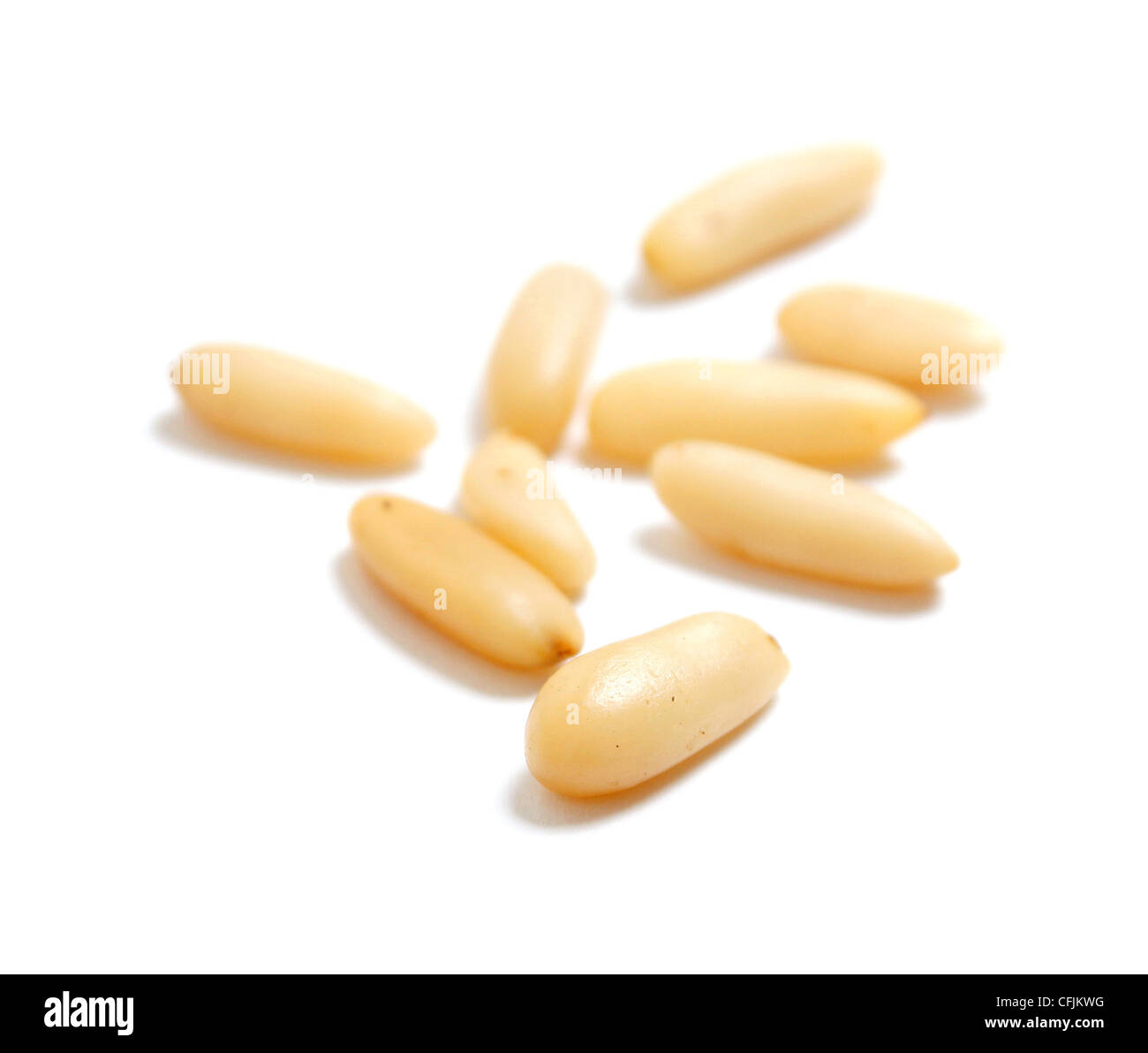 Delicious pine nuts isolated on white Stock Photo