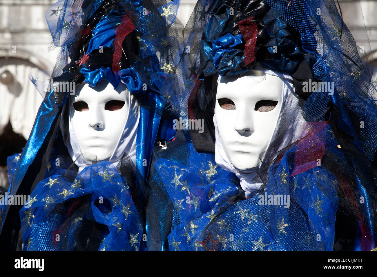 People dressed up in blue carnival costume for the Carnival of Venice