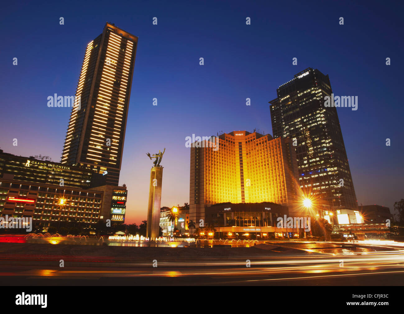 Welcome Monument and Grand Hyatt Hotel at dusk, Jakarta, Java, Indonesia, Southeast Asia, Asia Stock Photo