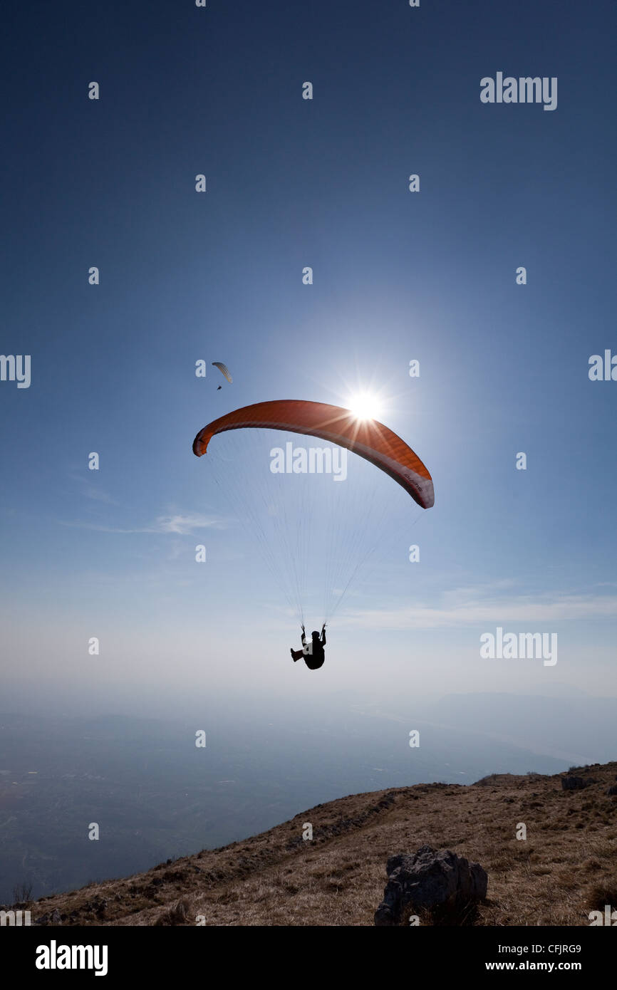 Paragliders flying over Mount Cuarnan, Udine, Friuli, Italy, Europe Stock Photo