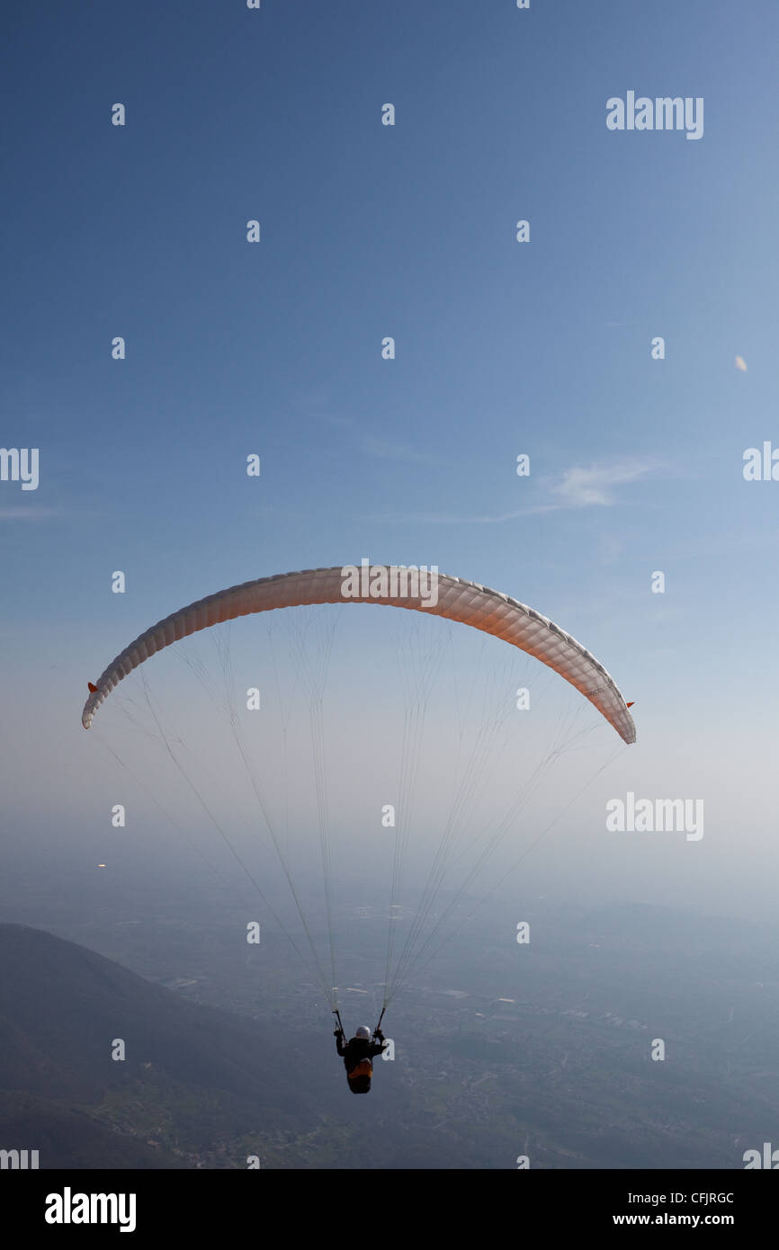 Paragliders flying over Mount Cuarnan, Udine, Friuli, Italy, Europe Stock Photo