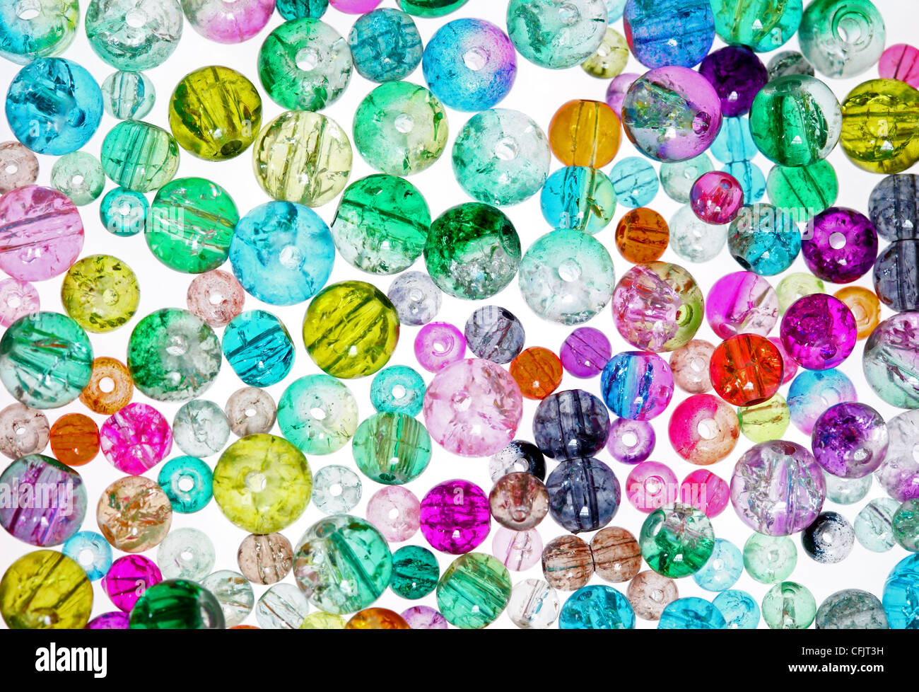 High Key Image of Colourful Glass Jewellery Making Beads on a White Background Stock Photo