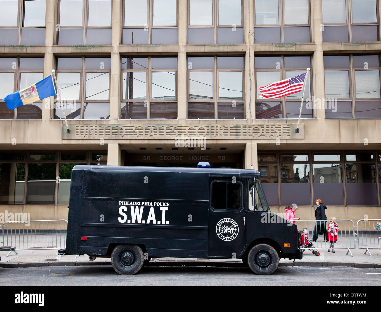 Glasgow's George Square turned into an American scene, S.W.A.T truck and US Court House sign and flags for movie World War Z Stock Photo