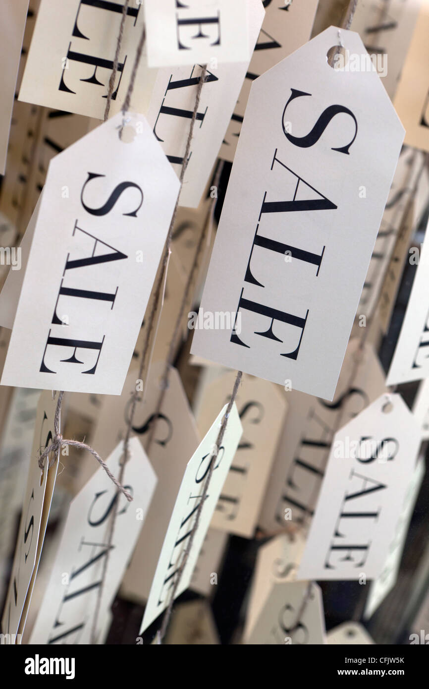 Sale tags in shop window, United Kingdom, Europe Stock Photo