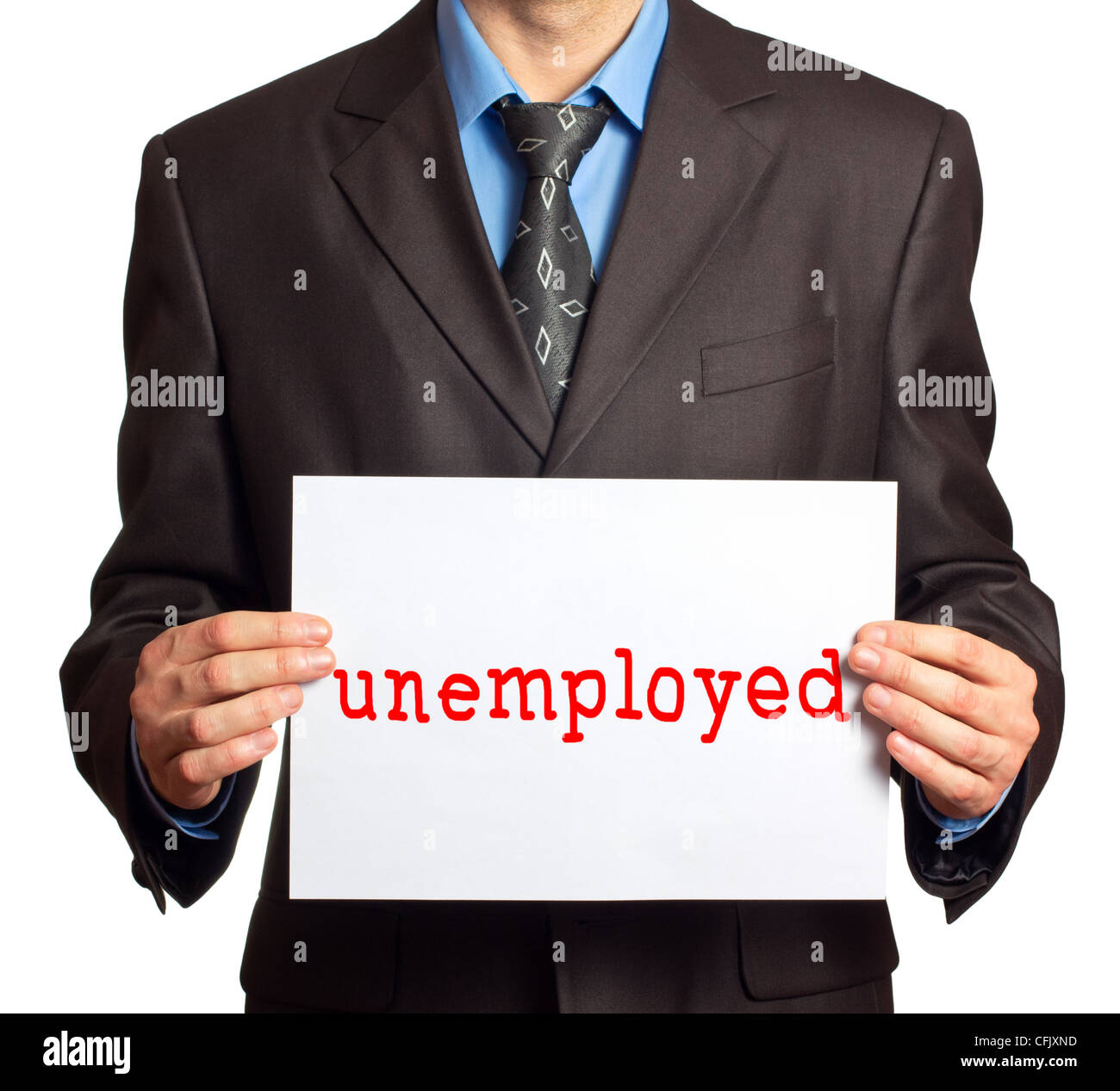 A man in a suit holding a sign that says 'unemployed' Stock Photo