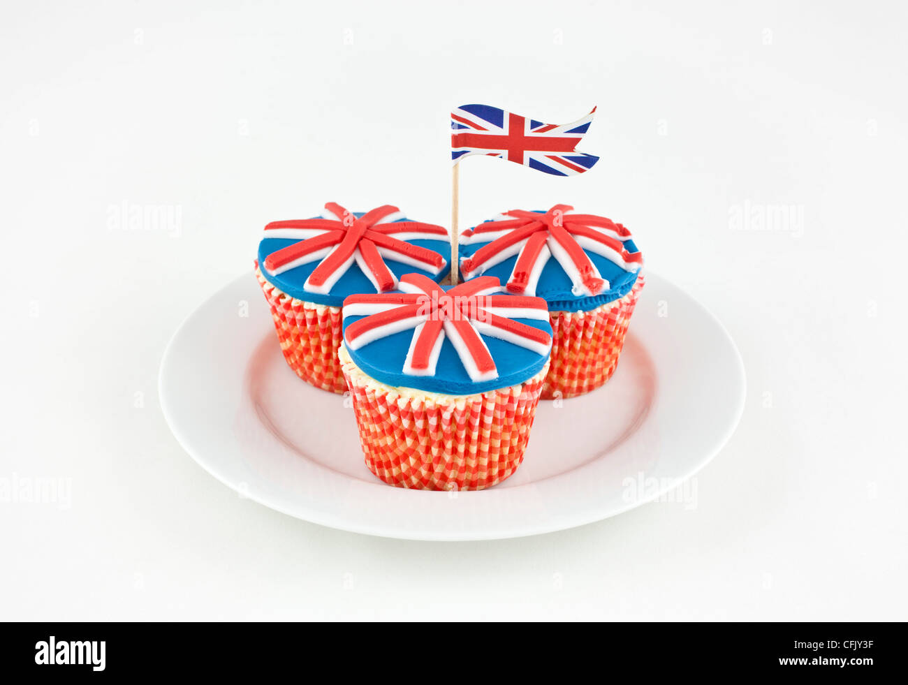 union jack flag cupcakes on plate on a white background Stock Photo - Alamy