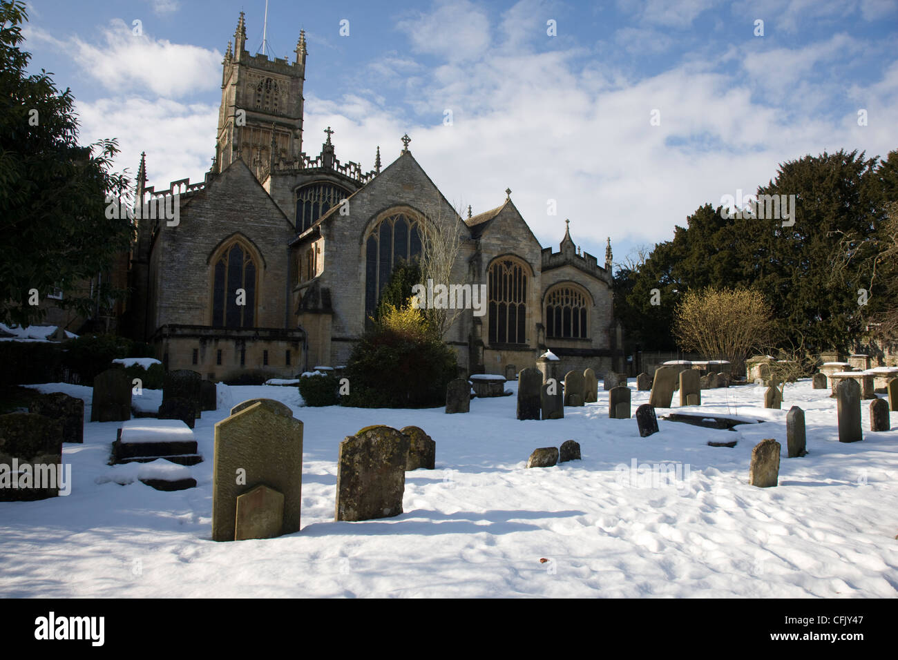 Cirencester parish church in the snow with blue skies and sunshine, Cirencester, Gloucestershire Stock Photo