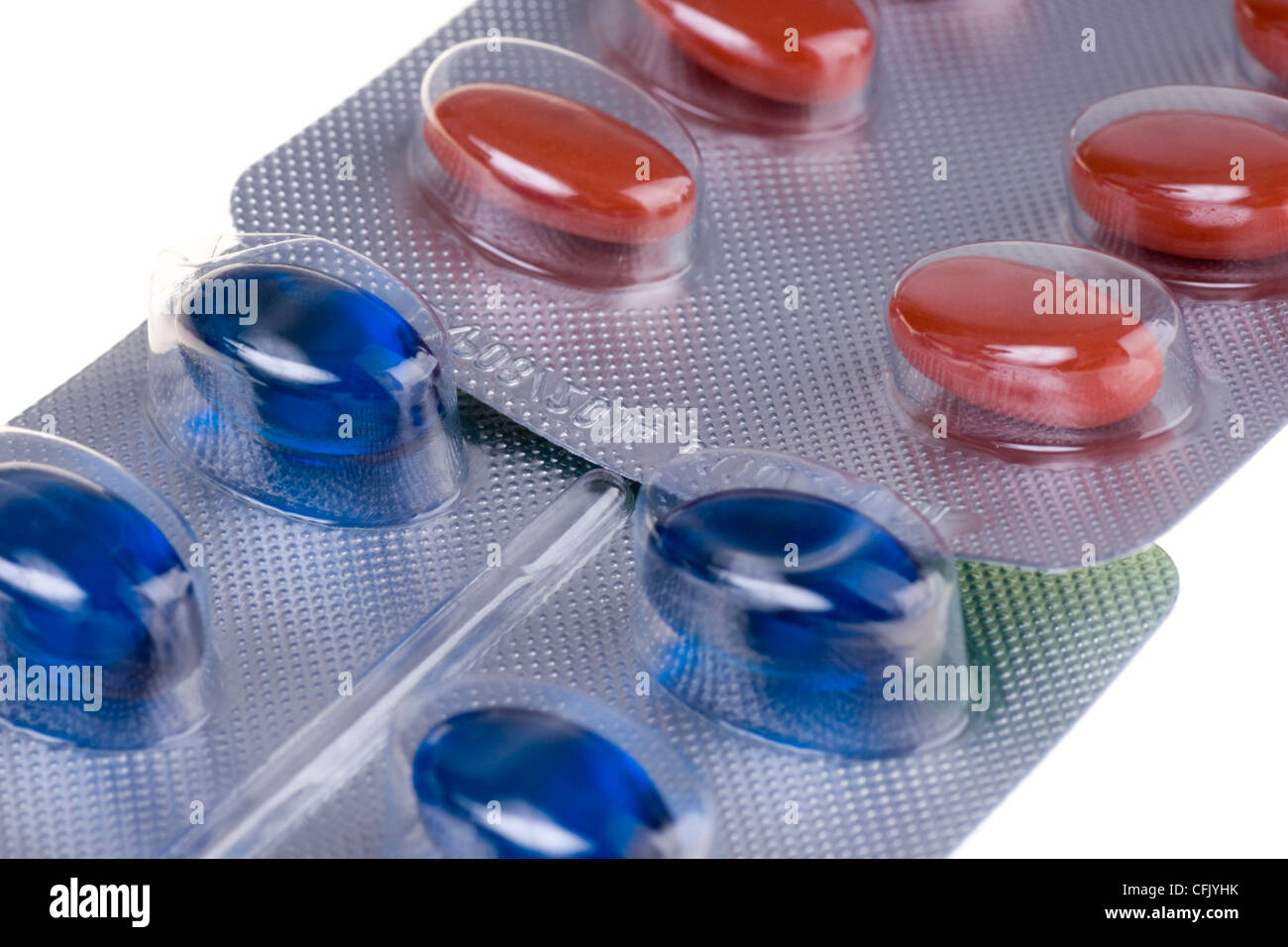 Red and blue tablets close up Stock Photo