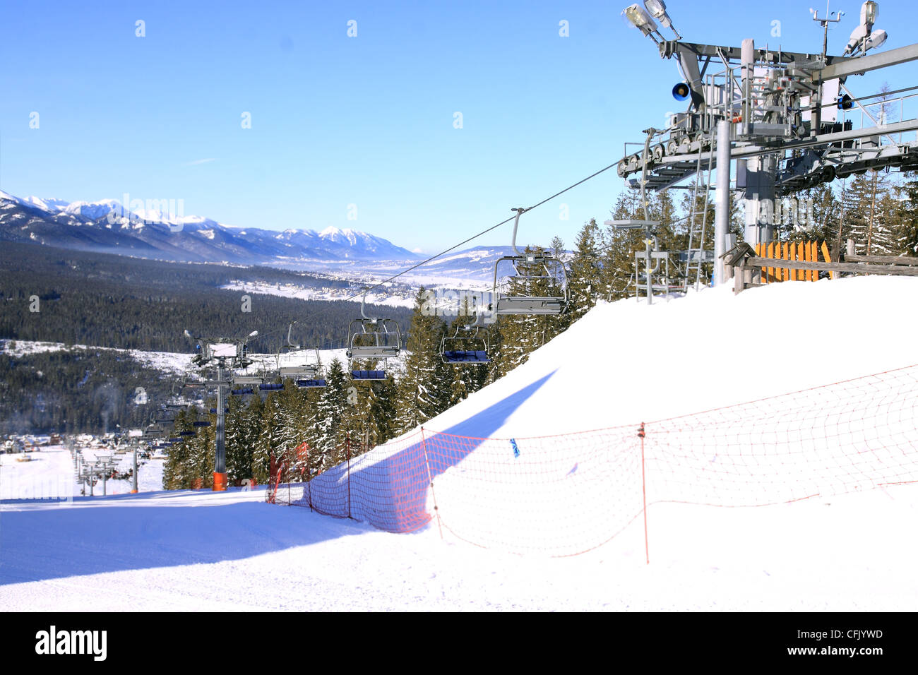 Chairlift skiers on rope hi-res stock photography and images - Alamy