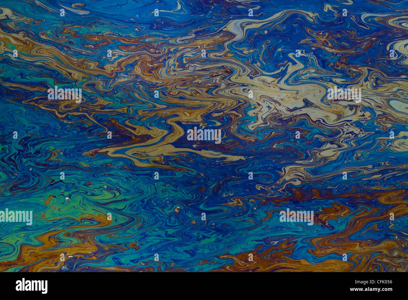 background of an oil slick on water showing the brilliant colors Stock Photo