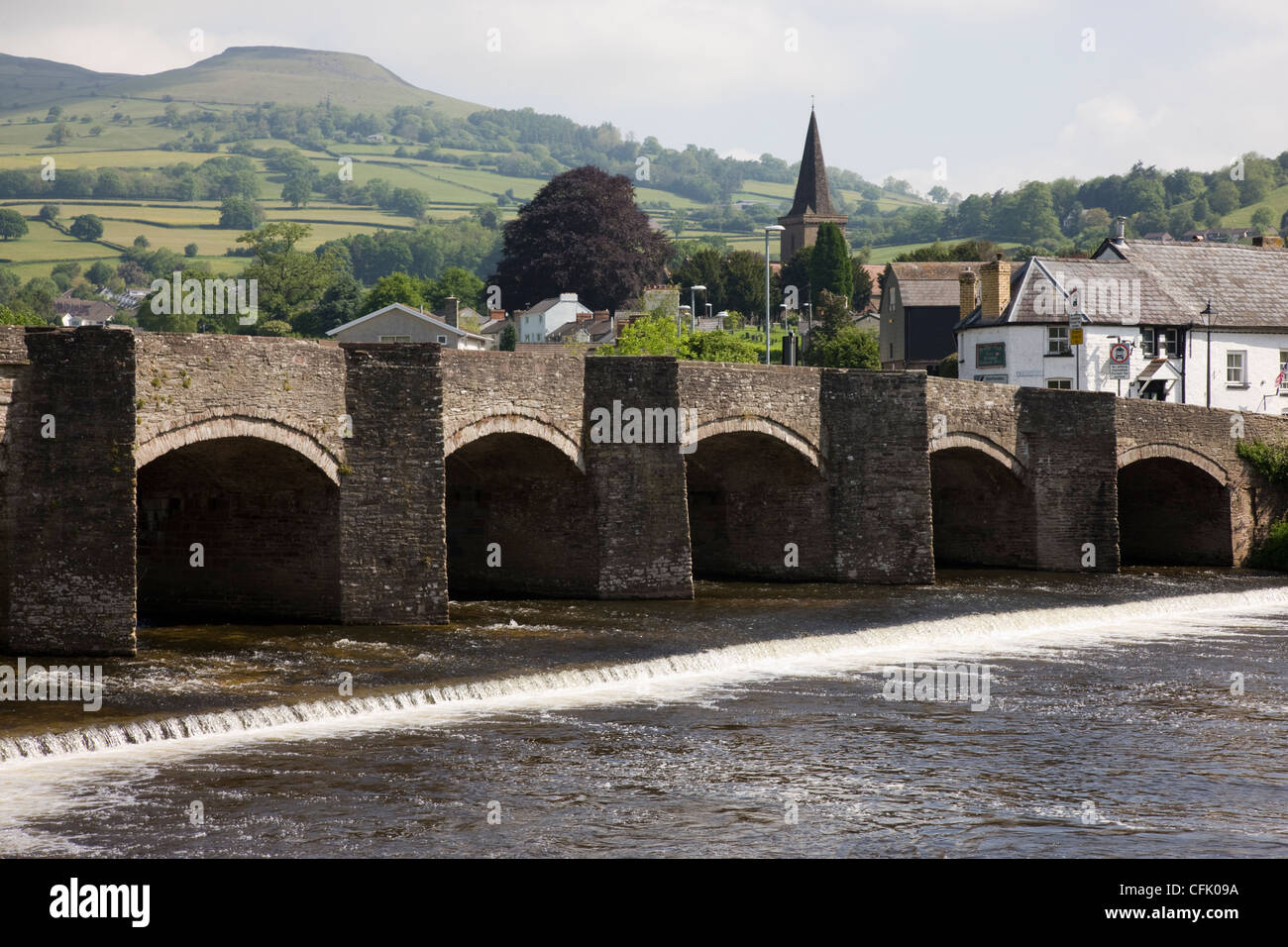 View of Crickhowell with the arched packhorse bridge over the River Usk in Powys, Wales Stock Photo