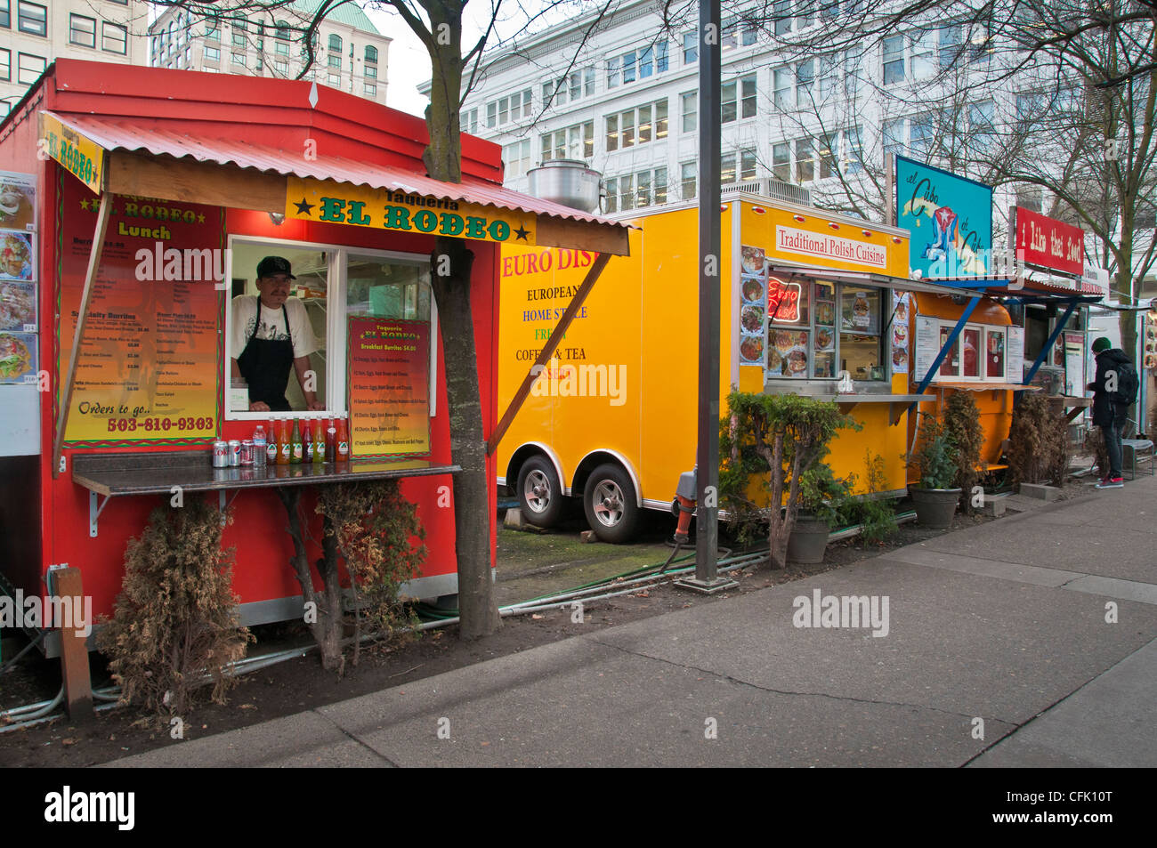 Food carts in downtown Portland, Oregon at 10th and Alder Streets. Stock Photo