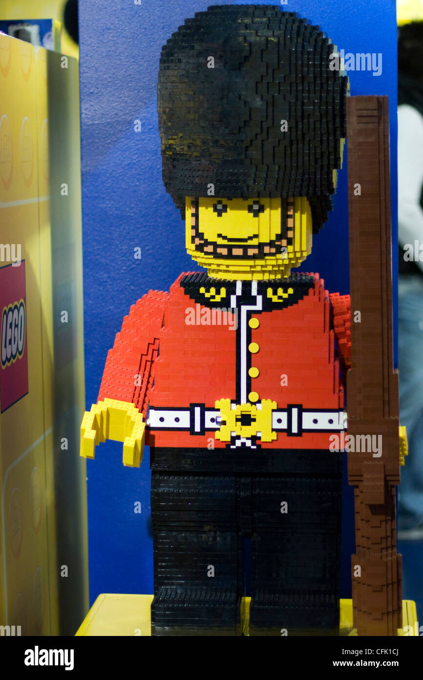 The Queens Guard with Gun standing at his post made out of Lego in London England Stock Photo