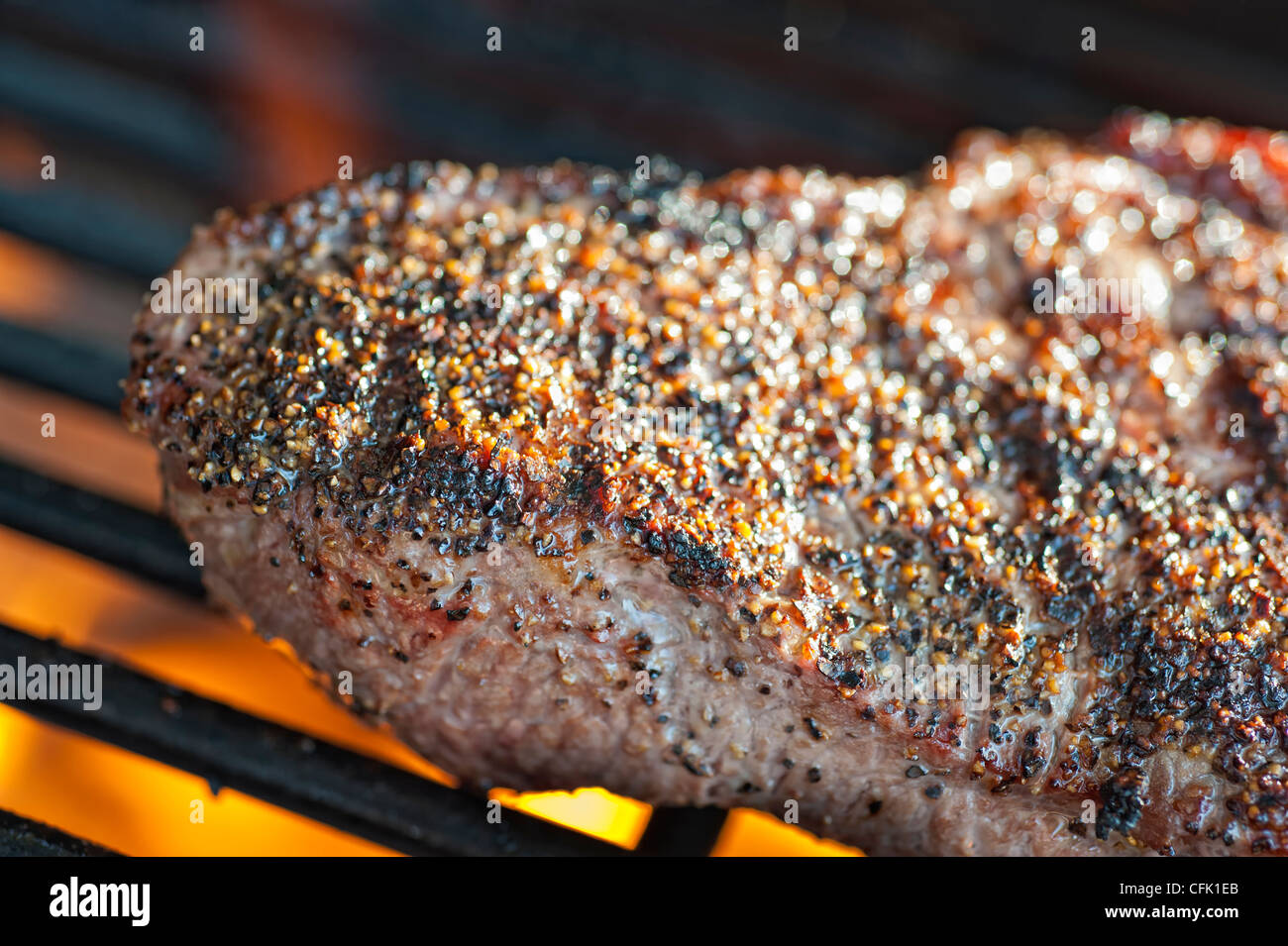Beef Steak grilling on hot barbecue grill cooking grate Stock Photo Alamy