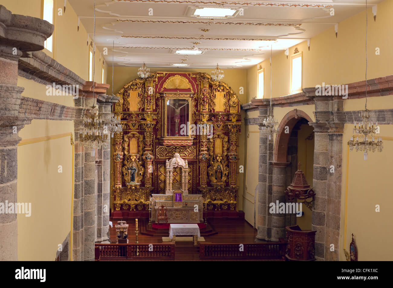 Inside Franciscan monastery church of Amacueca Mexico featuring churrigueresco style adornments of altar and surroundings Stock Photo