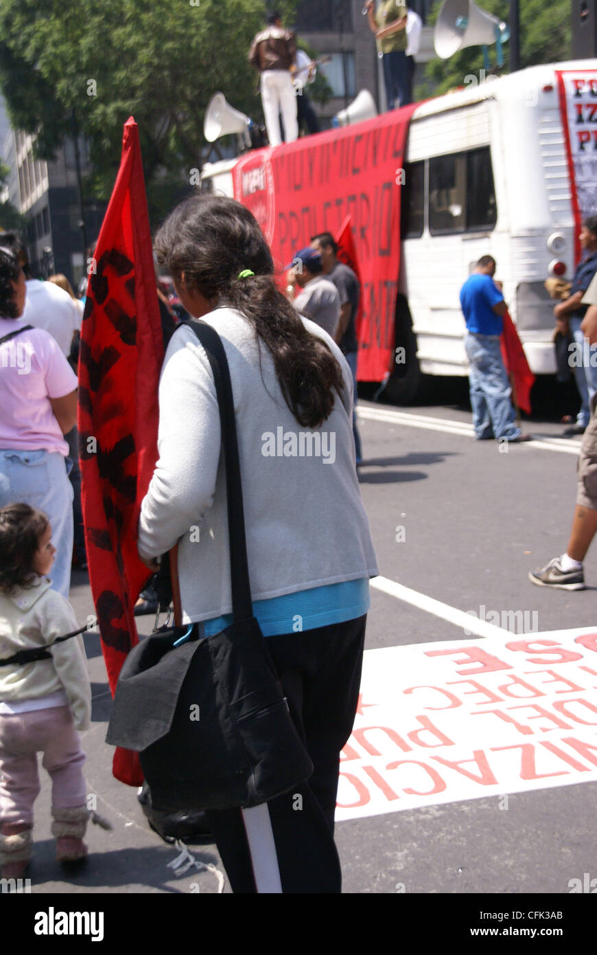 Woman holding red flag at a demonstration, Mexico City, Mexico  Stock Photo