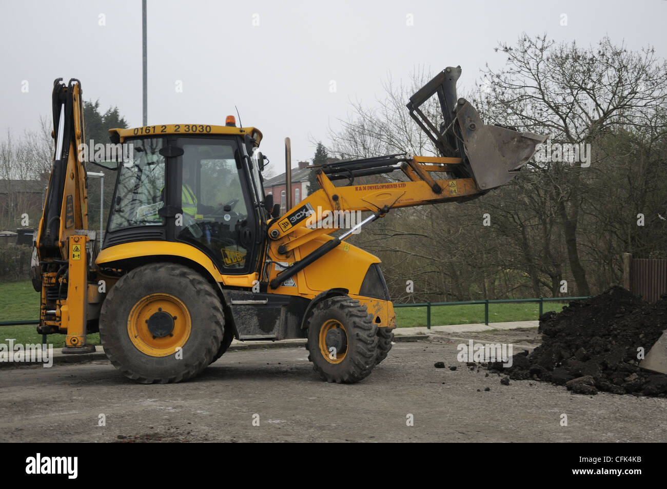 JCB with full bucket load Stock Photo