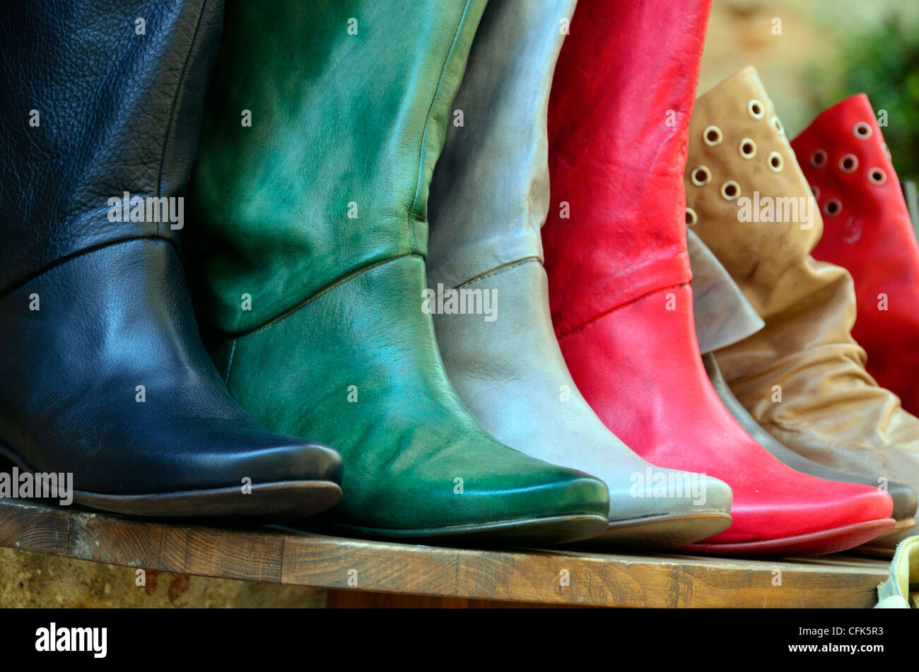 Colorful boots on display at shop in Pienza Italy Stock Photo Alamy